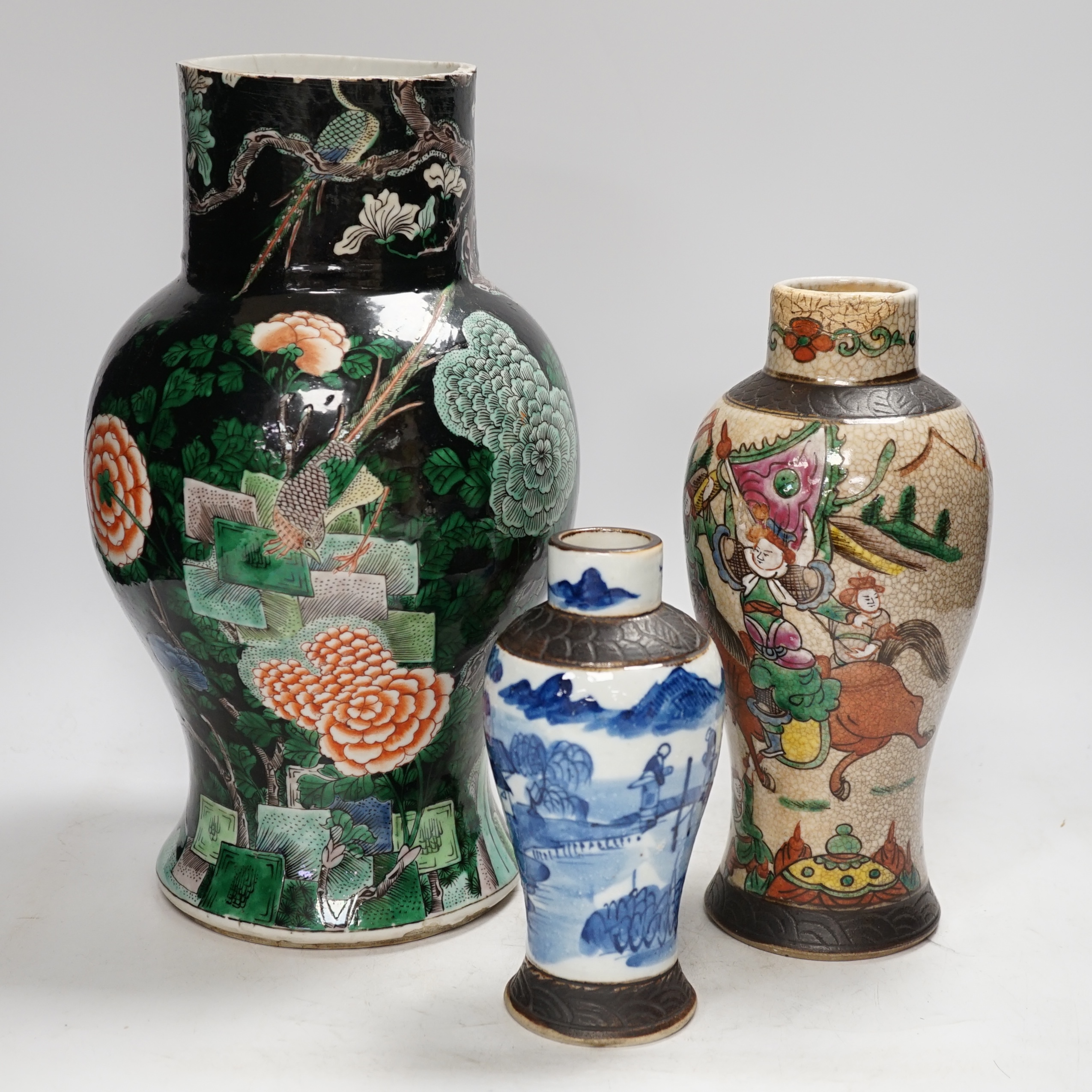 Three Chinese vases, 19th/early 20th century, including a cut down famille noire vase, crackleglaze and blue and white vases, tallest 34cm. Condition - fair to poor